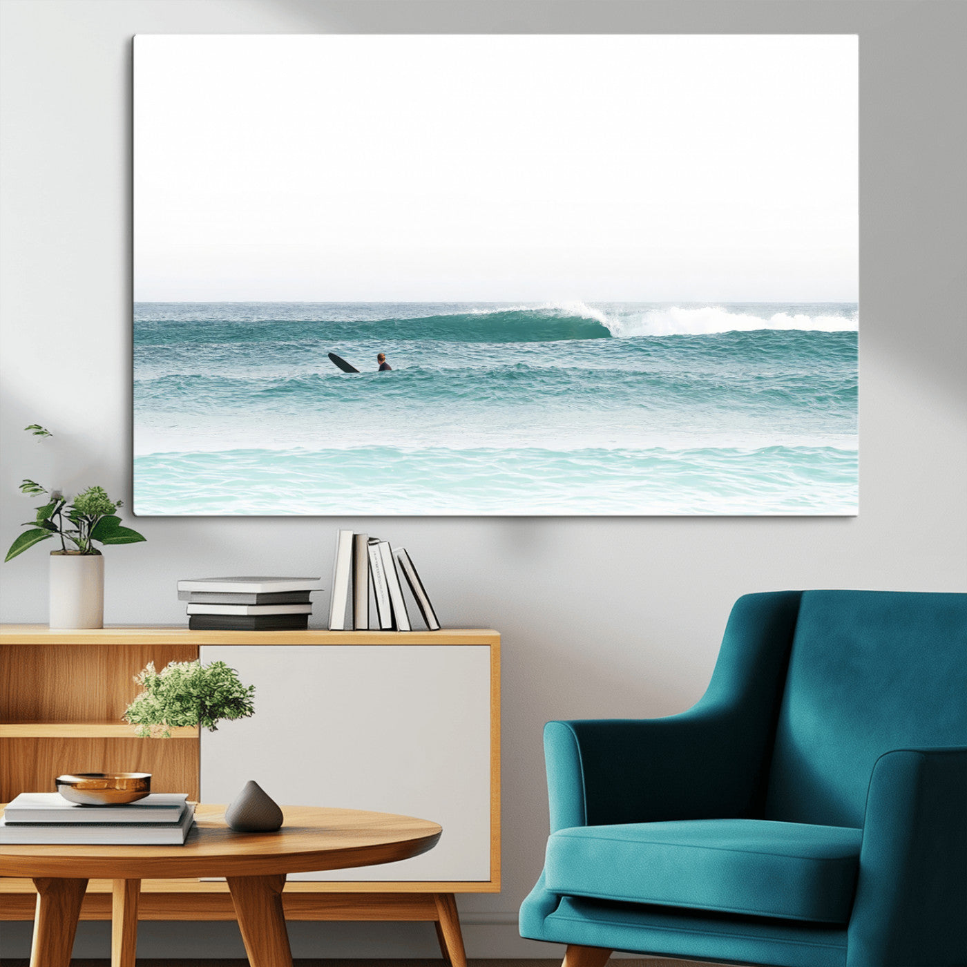 Minimalist photo of a lone surfer on calm aqua waves under bright sky, perfect for Scandinavian coastal or serene ocean-inspired home decor.