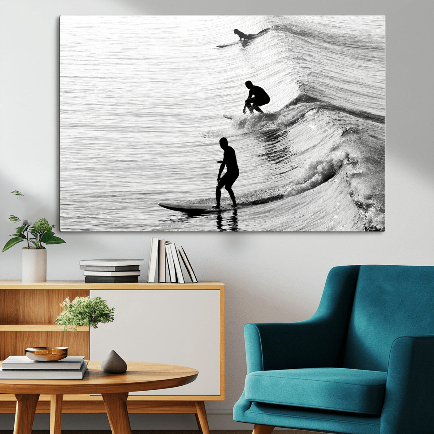 Black and white photo of surfers riding waves in a moody, high-contrast scene, ideal for modern coastal or surf-inspired home decor.