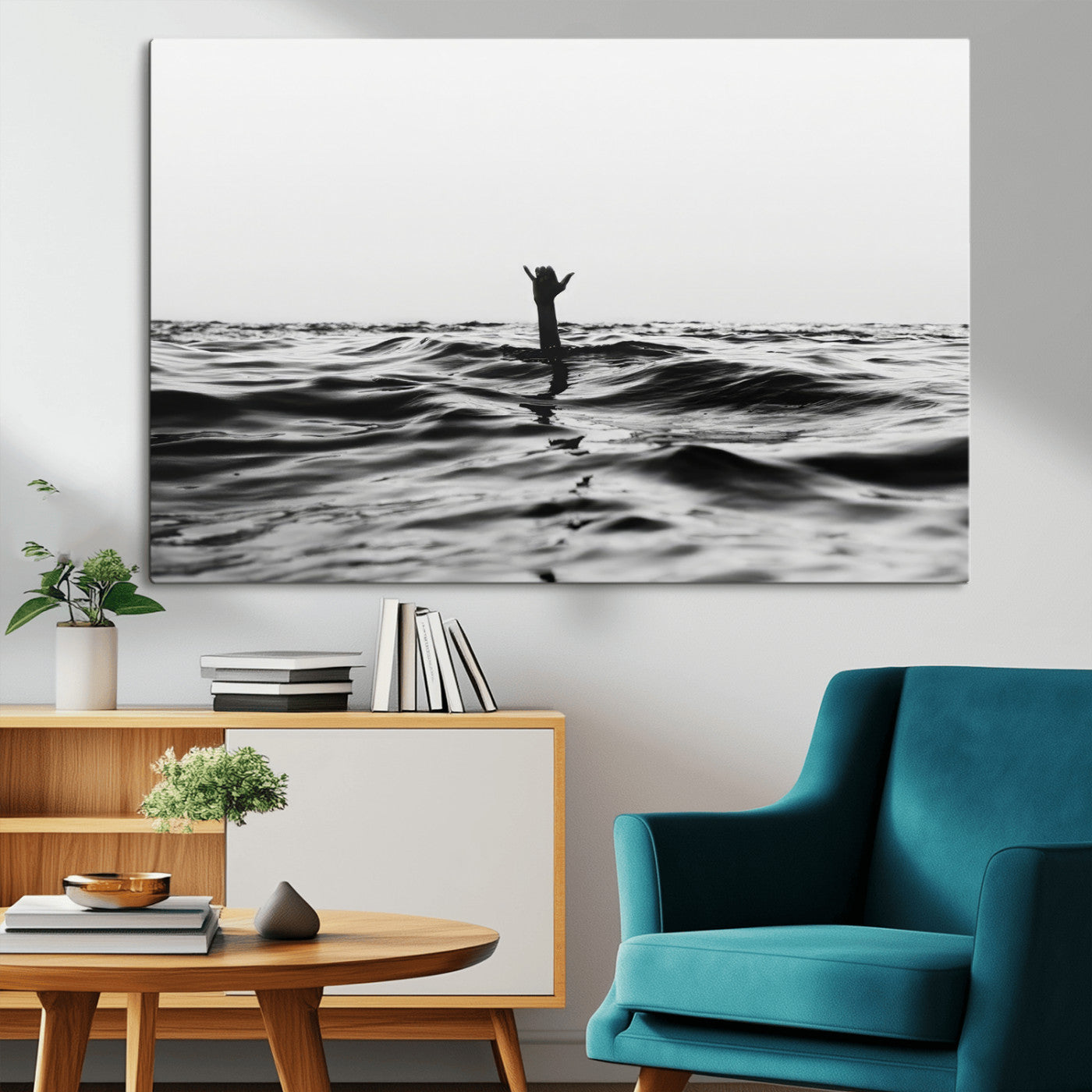 Black and white ocean with a hand making a surfer sign among dark waves, creating a dramatic and minimalist seascape with bold contrast.