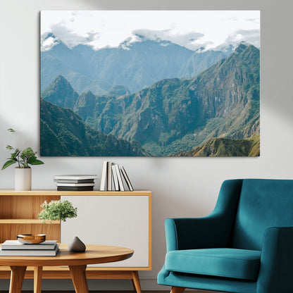 A misty mountain landscape with cloud-covered Andean peaks and lush green valleys, creating a dramatic and serene view, perfect for rustic or nature-inspired home decor.