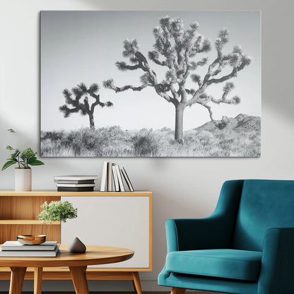 Black and white Joshua tree in a desert landscape with soft light and dry brush, perfect for rustic or minimalist home decor.