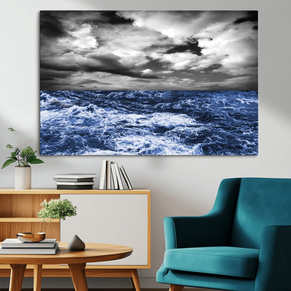 Moody canvas wall art of a stormy ocean under a dramatic black-and-white sky, perfect for bold or coastal-style interiors.