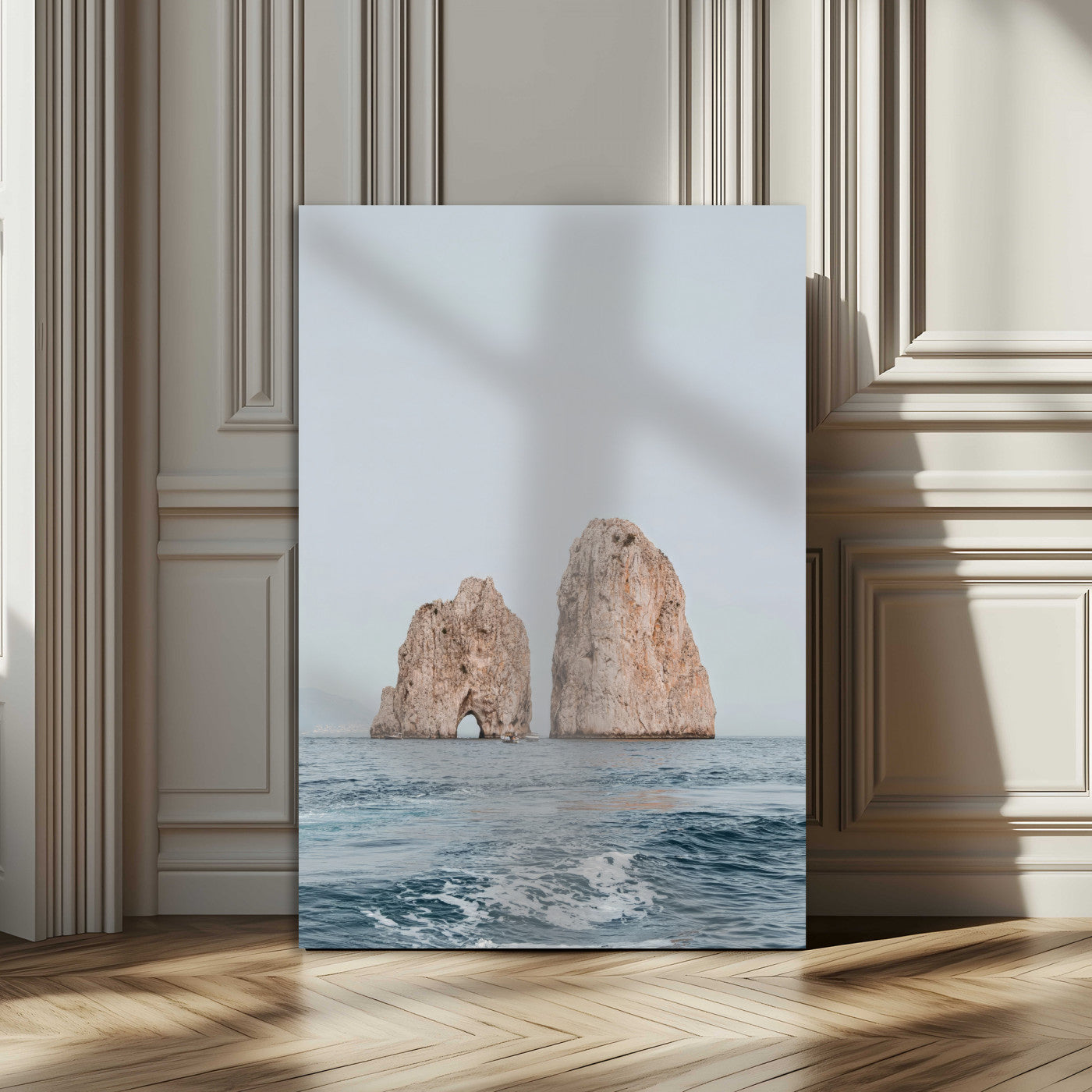 Serene photograph of the Faraglioni rocks in Capri with calm blue waters, perfect for Mediterranean coastal or minimalist travel-themed decor.