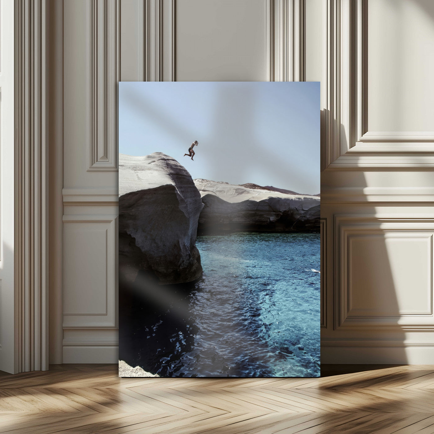 Canvas of a cliff diver above turquoise waters and rocky coastline under clear sky, ideal for adventurous minimalist or coastal home decor.