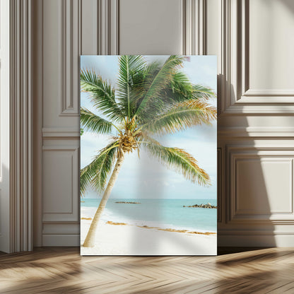 A tall palm tree leaning over a white sandy beach with turquoise ocean waves, creating a peaceful and tropical coastal scene.