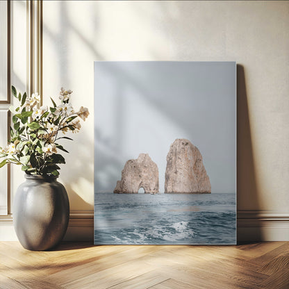 Serene photograph of the Faraglioni rocks in Capri with calm blue waters, perfect for Mediterranean coastal or minimalist travel-themed decor.