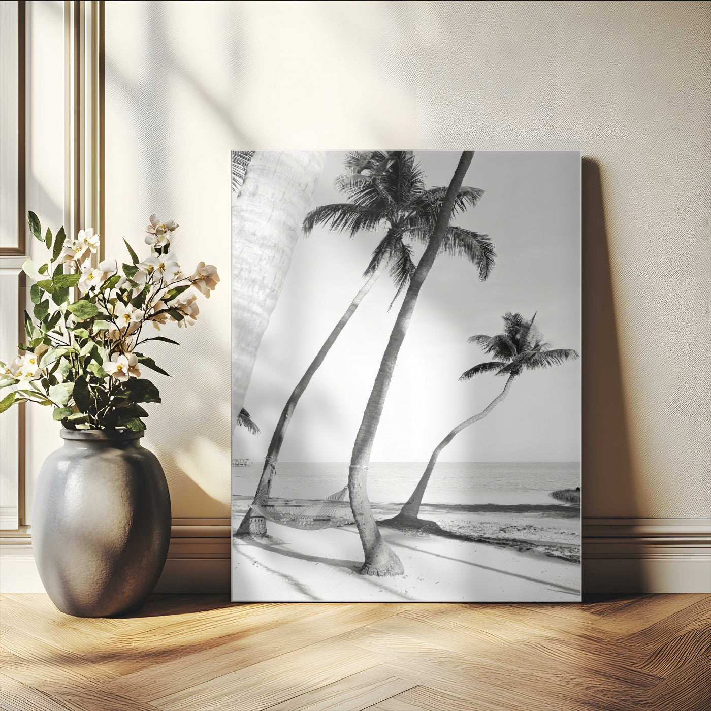 Black and white wall art of palm trees and a hammock on a beach, ideal for coastal minimalist or tropical-themed decor.