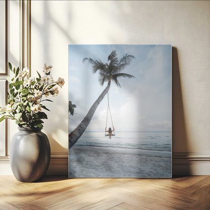 Wall art of a girl on a swing hanging from a palm tree over calm ocean waters, perfect for tropical or minimalist coastal decor.