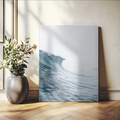 A single ocean wave curling in soft blue tones under a misty sky, ideal for coastal or minimalist home wall decor.
