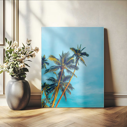 "Tall palm trees with golden sunlight against a vibrant blue sky, creating a tropical, relaxing atmosphere for coastal and beach-themed decor.