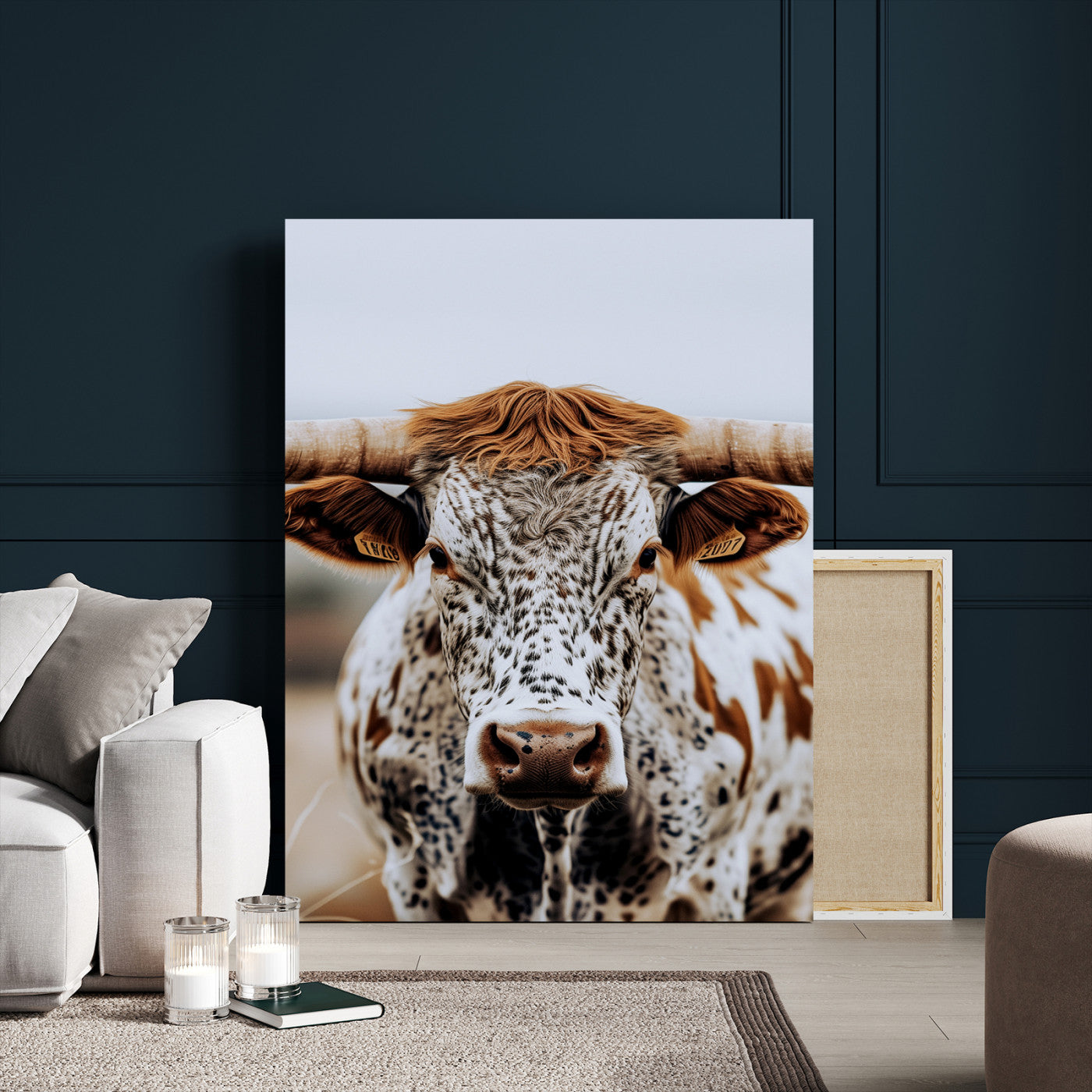 Close-up of a speckled Texas longhorn with wide horns and a bold gaze, perfect for rustic or country-style decor in warm tones.