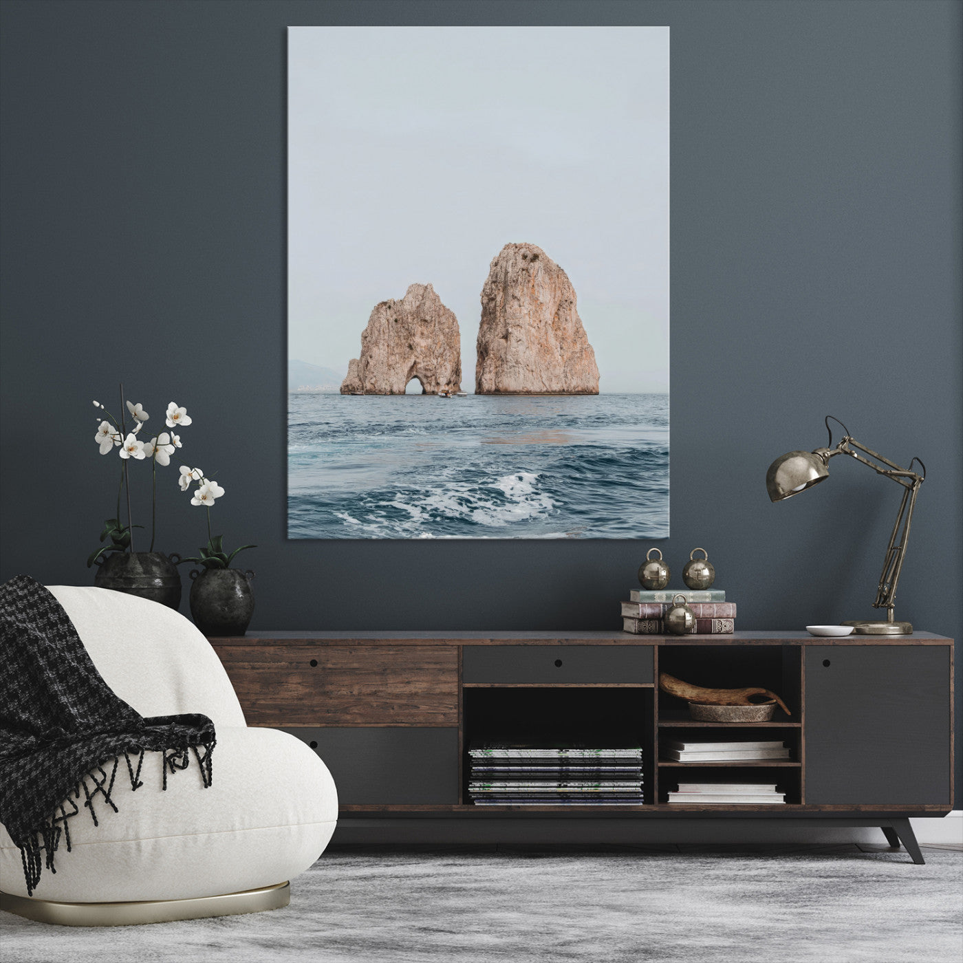 Serene photograph of the Faraglioni rocks in Capri with calm blue waters, perfect for Mediterranean coastal or minimalist travel-themed decor.