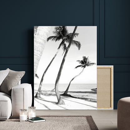 Black and white wall art of palm trees and a hammock on a beach, ideal for coastal minimalist or tropical-themed decor.