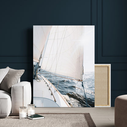 Canvas of a sailboat gliding on a sunlit ocean with white sails and sparkling water, ideal for coastal minimalist or nautical-style home decor.