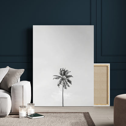 Canvas of a single palm tree in black and white with minimalist sky, ideal for modern coastal minimalist or tropical-inspired home decor.