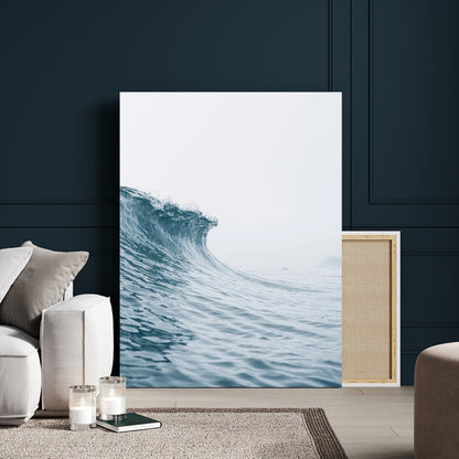 A single ocean wave curling in soft blue tones under a misty sky, ideal for coastal or minimalist home wall decor.