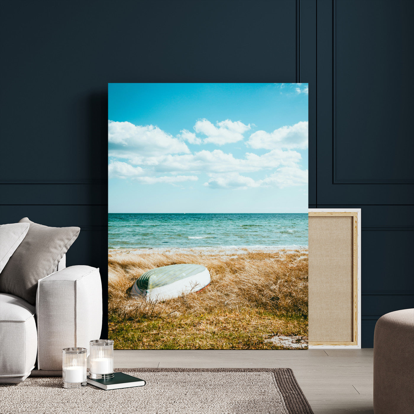 A small boat resting on a grassy shore with ocean waves and a bright blue sky, creating a peaceful coastal atmosphere.
