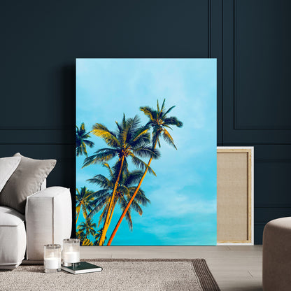 "Tall palm trees with golden sunlight against a vibrant blue sky, creating a tropical, relaxing atmosphere for coastal and beach-themed decor.