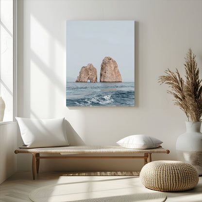 Serene photograph of the Faraglioni rocks in Capri with calm blue waters, perfect for Mediterranean coastal or minimalist travel-themed decor.