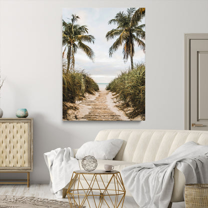 Canvas wall art of a tropical beach path with palm trees and dune grass, ideal for coastal entryways or tropical-inspired home decor.