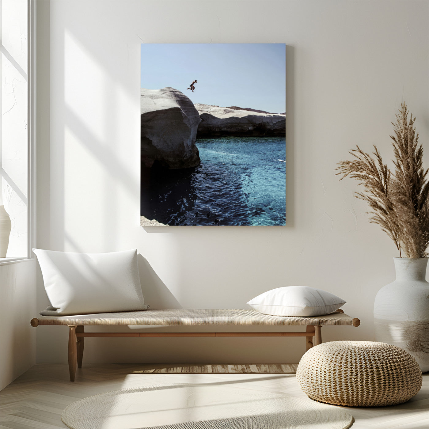 Canvas of a cliff diver above turquoise waters and rocky coastline under clear sky, ideal for adventurous minimalist or coastal home decor.