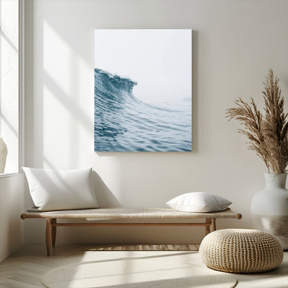 A single ocean wave curling in soft blue tones under a misty sky, ideal for coastal or minimalist home wall decor.