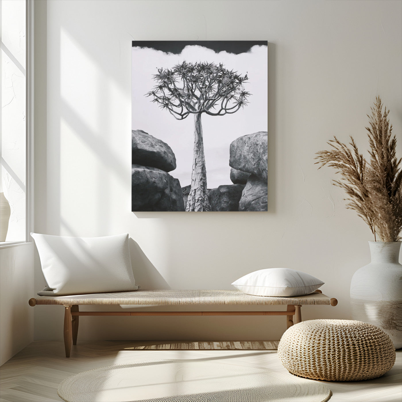 Tall desert tree in black and white, standing between large rocks, perfect for bold and minimalist nature-themed interior spaces.