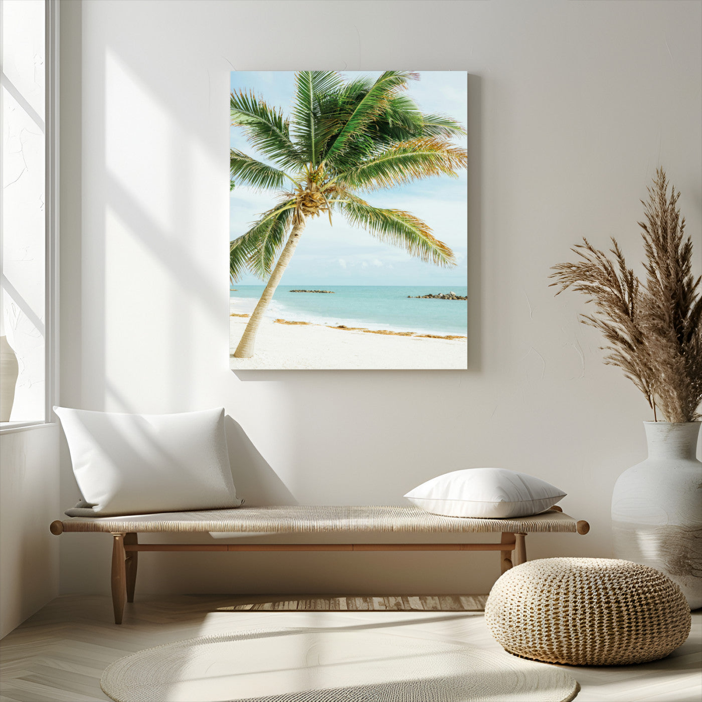 A tall palm tree leaning over a white sandy beach with turquoise ocean waves, creating a peaceful and tropical coastal scene.
