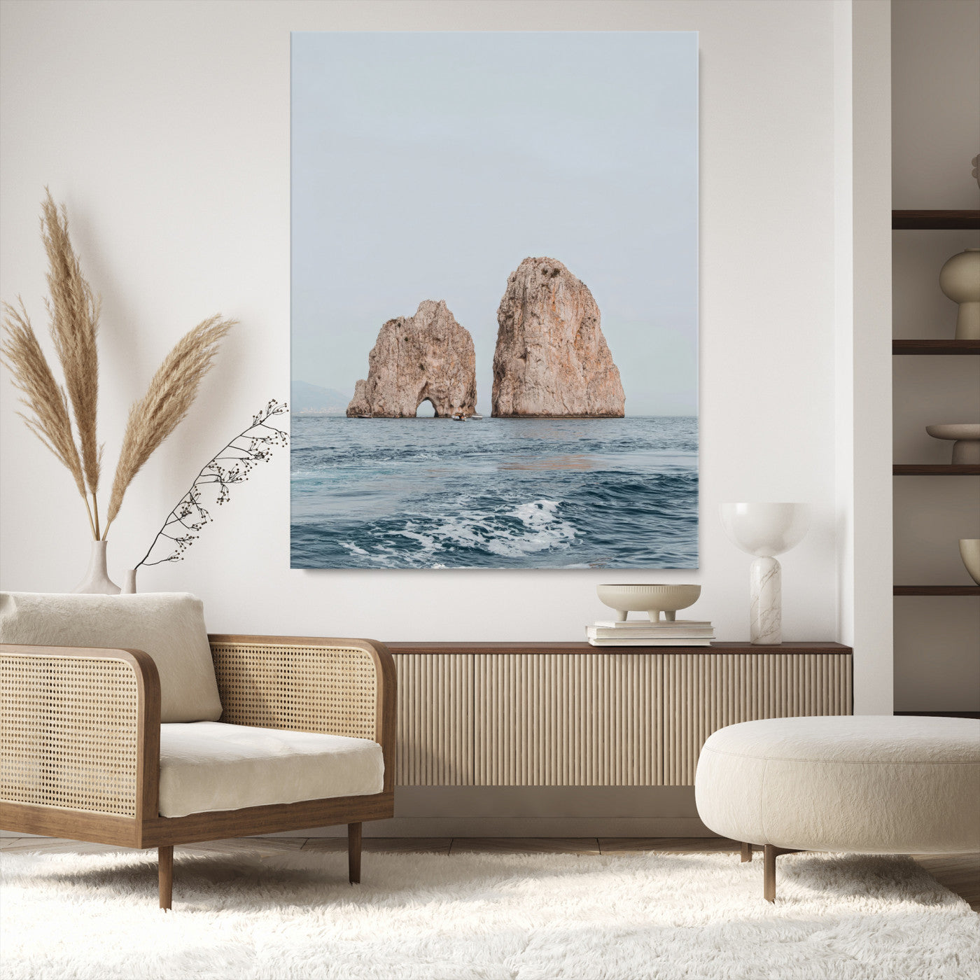 Serene photograph of the Faraglioni rocks in Capri with calm blue waters, perfect for Mediterranean coastal or minimalist travel-themed decor.