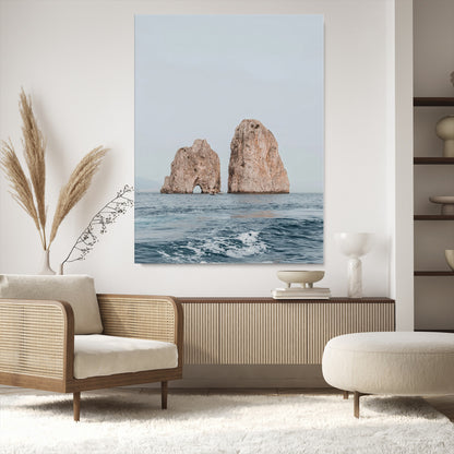 Serene photograph of the Faraglioni rocks in Capri with calm blue waters, perfect for Mediterranean coastal or minimalist travel-themed decor.