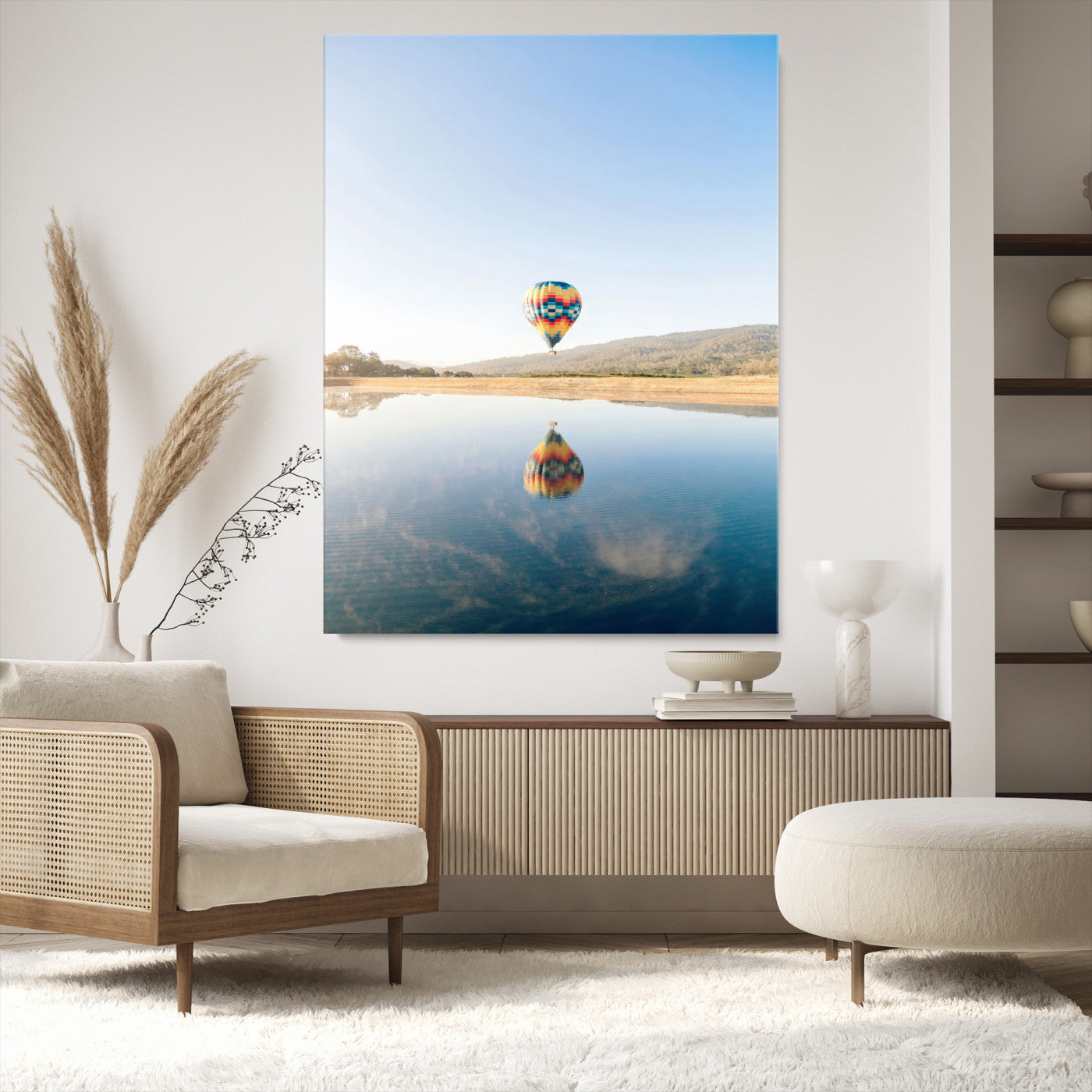 Canvas of a hot air balloon floating above a calm lake with soft reflections and vibrant sky, ideal for modern minimalist or adventure-themed home decor.