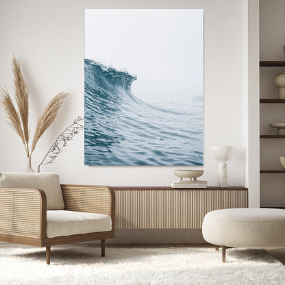A single ocean wave curling in soft blue tones under a misty sky, ideal for coastal or minimalist home wall decor.