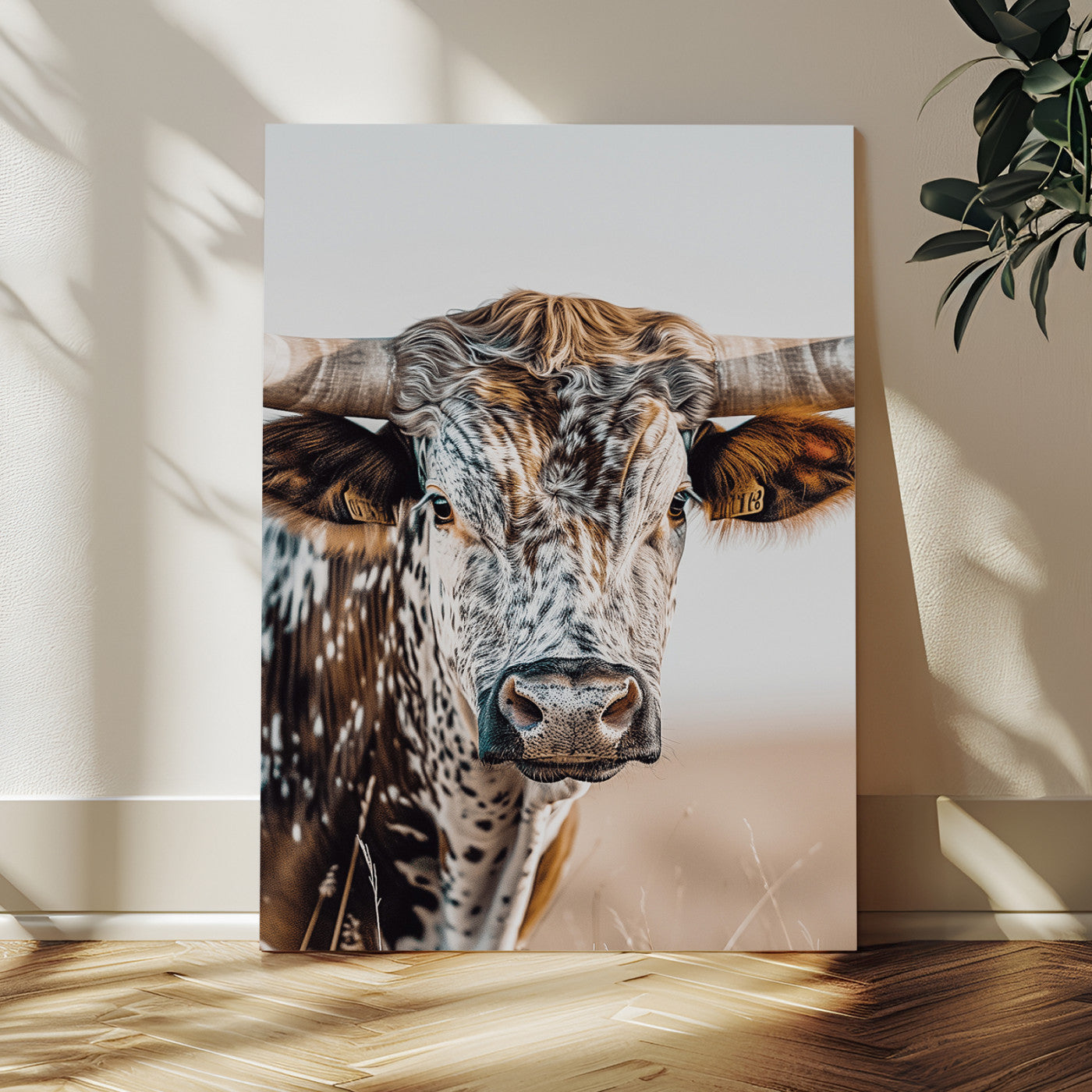 Canvas of a speckled Texas longhorn with wide curved horns and warm tones, perfect for rustic or country-style wall decor.