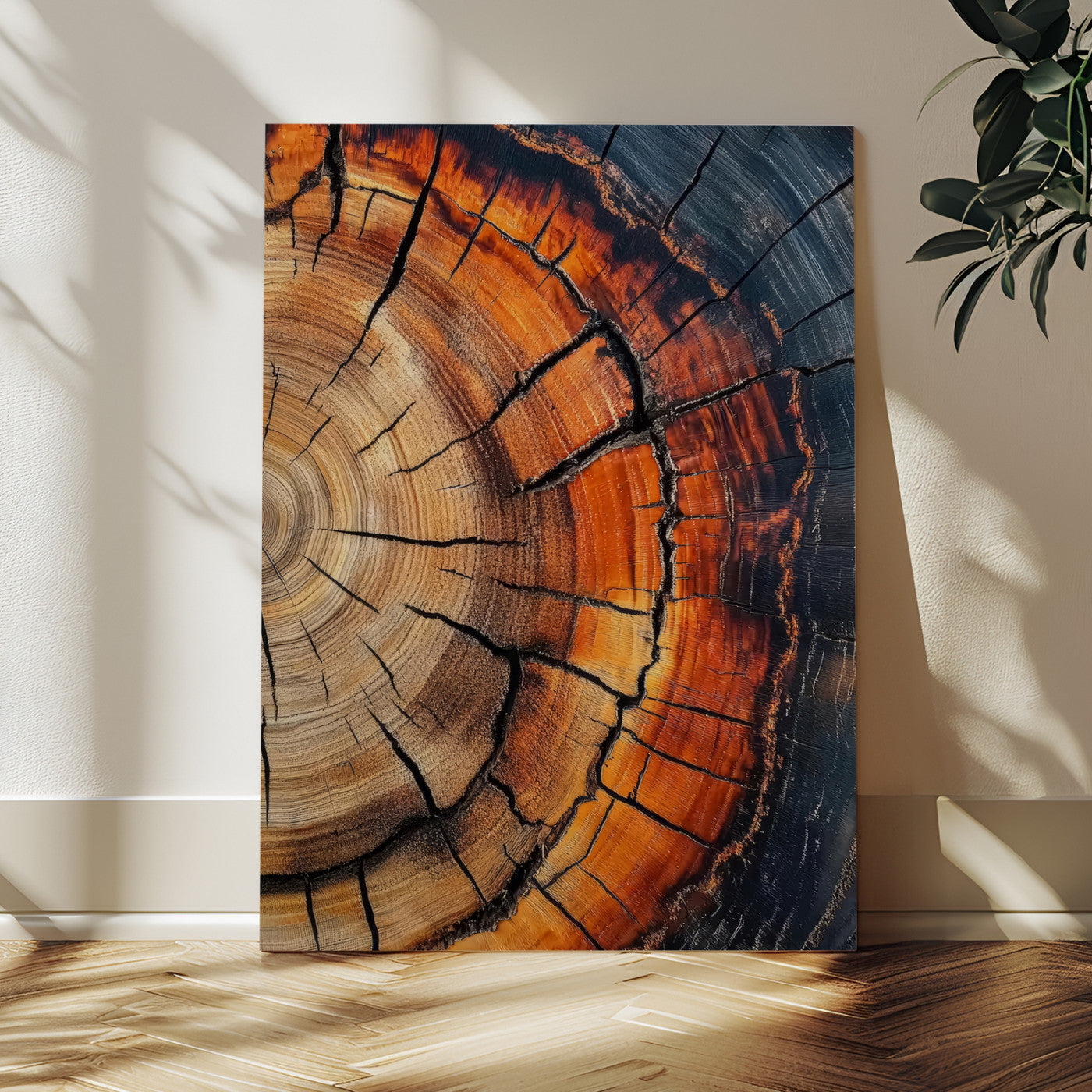 Framed canvas of burnt tree rings with rich wood texture and warm tones, ideal for rustic or earth-inspired interior decor.