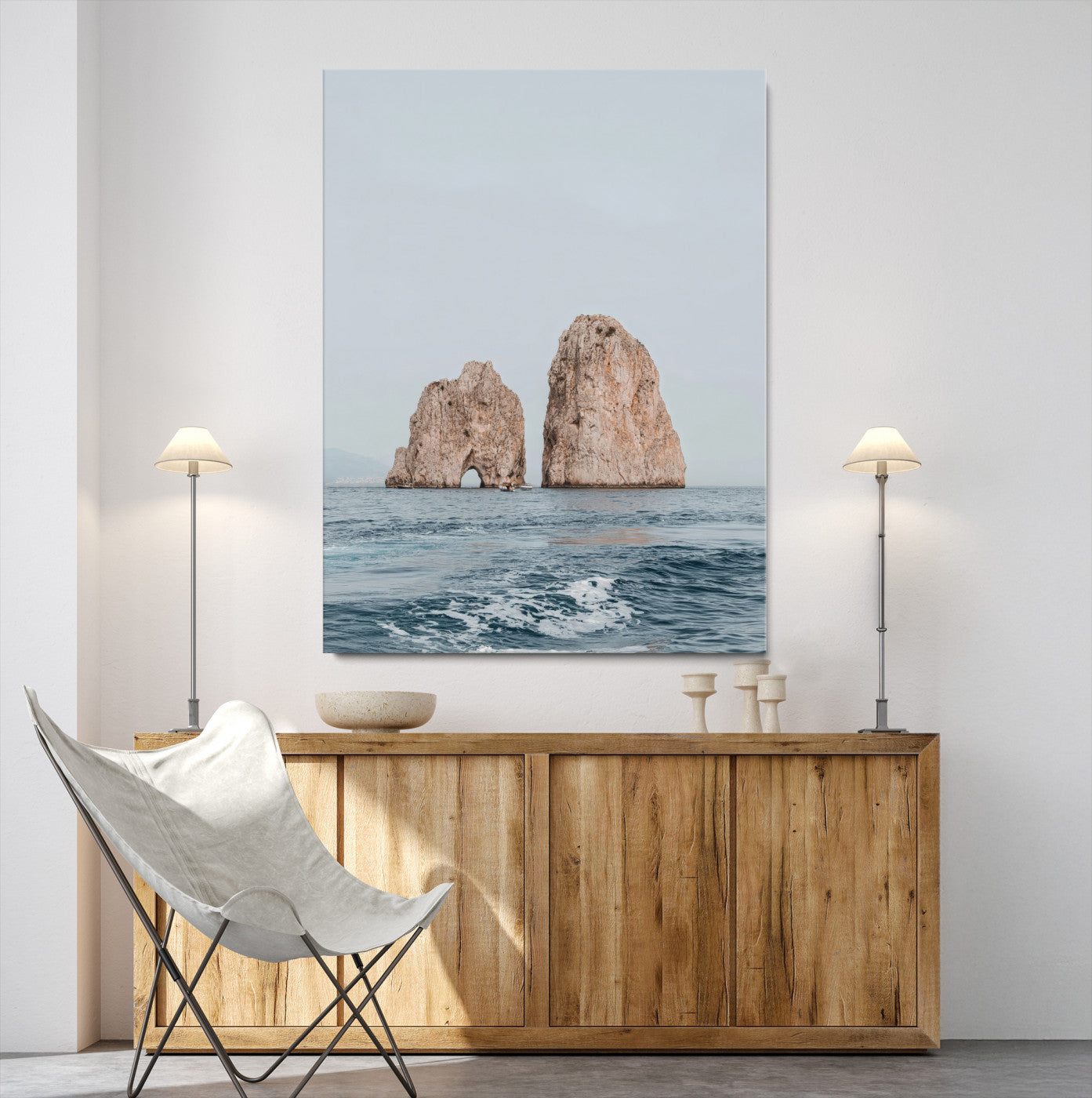 Serene photograph of the Faraglioni rocks in Capri with calm blue waters, perfect for Mediterranean coastal or minimalist travel-themed decor.
