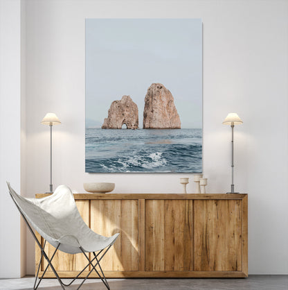 Serene photograph of the Faraglioni rocks in Capri with calm blue waters, perfect for Mediterranean coastal or minimalist travel-themed decor.