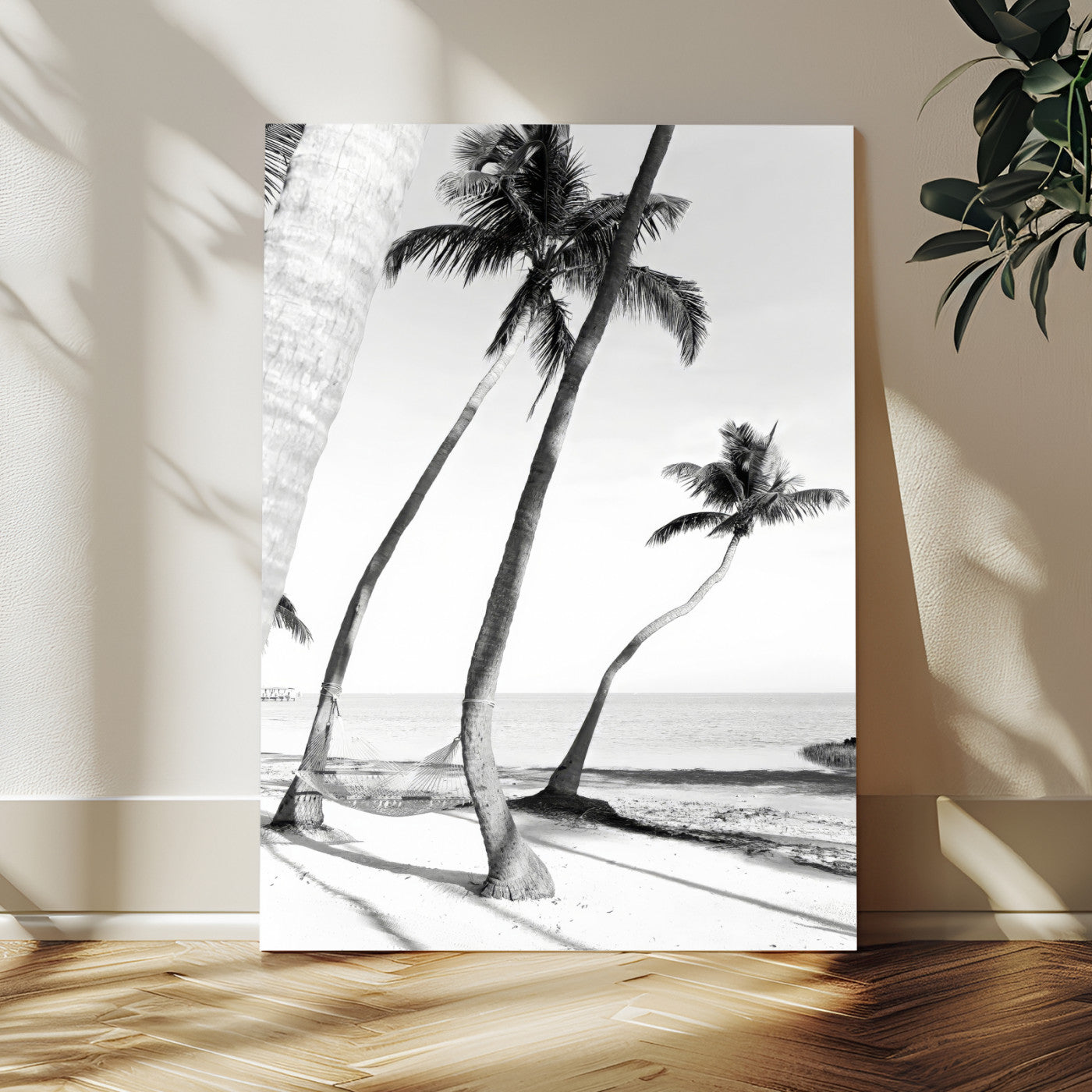 Black and white wall art of palm trees and a hammock on a beach, ideal for coastal minimalist or tropical-themed decor.