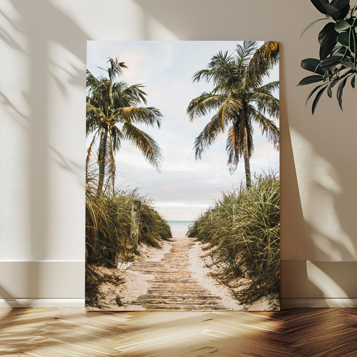 Canvas wall art of a tropical beach path with palm trees and dune grass, ideal for coastal entryways or tropical-inspired home decor.