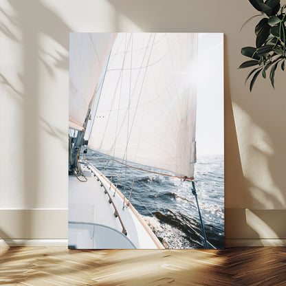 Canvas of a sailboat gliding on a sunlit ocean with white sails and sparkling water, ideal for coastal minimalist or nautical-style home decor.