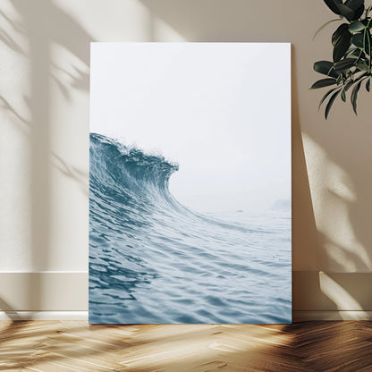 A single ocean wave curling in soft blue tones under a misty sky, ideal for coastal or minimalist home wall decor.