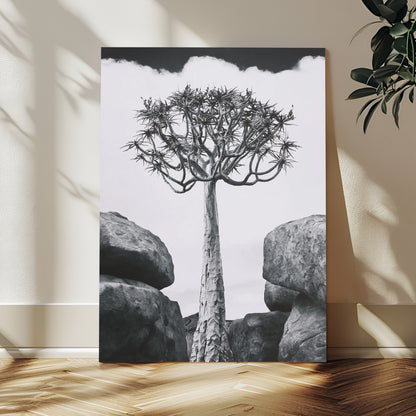 Tall desert tree in black and white, standing between large rocks, perfect for bold and minimalist nature-themed interior spaces.