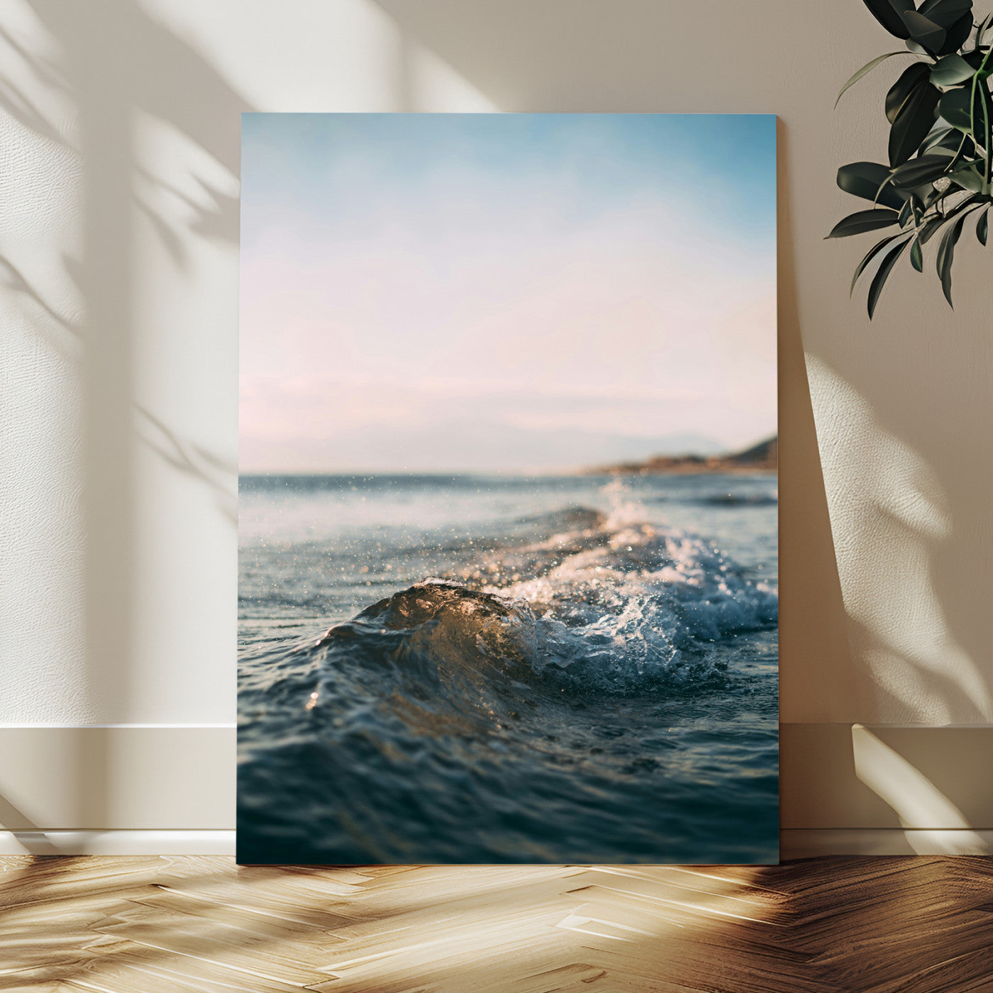 Close-up of ocean waves rolling gently toward the shore at sunset, creating a peaceful and minimalist coastal scene.