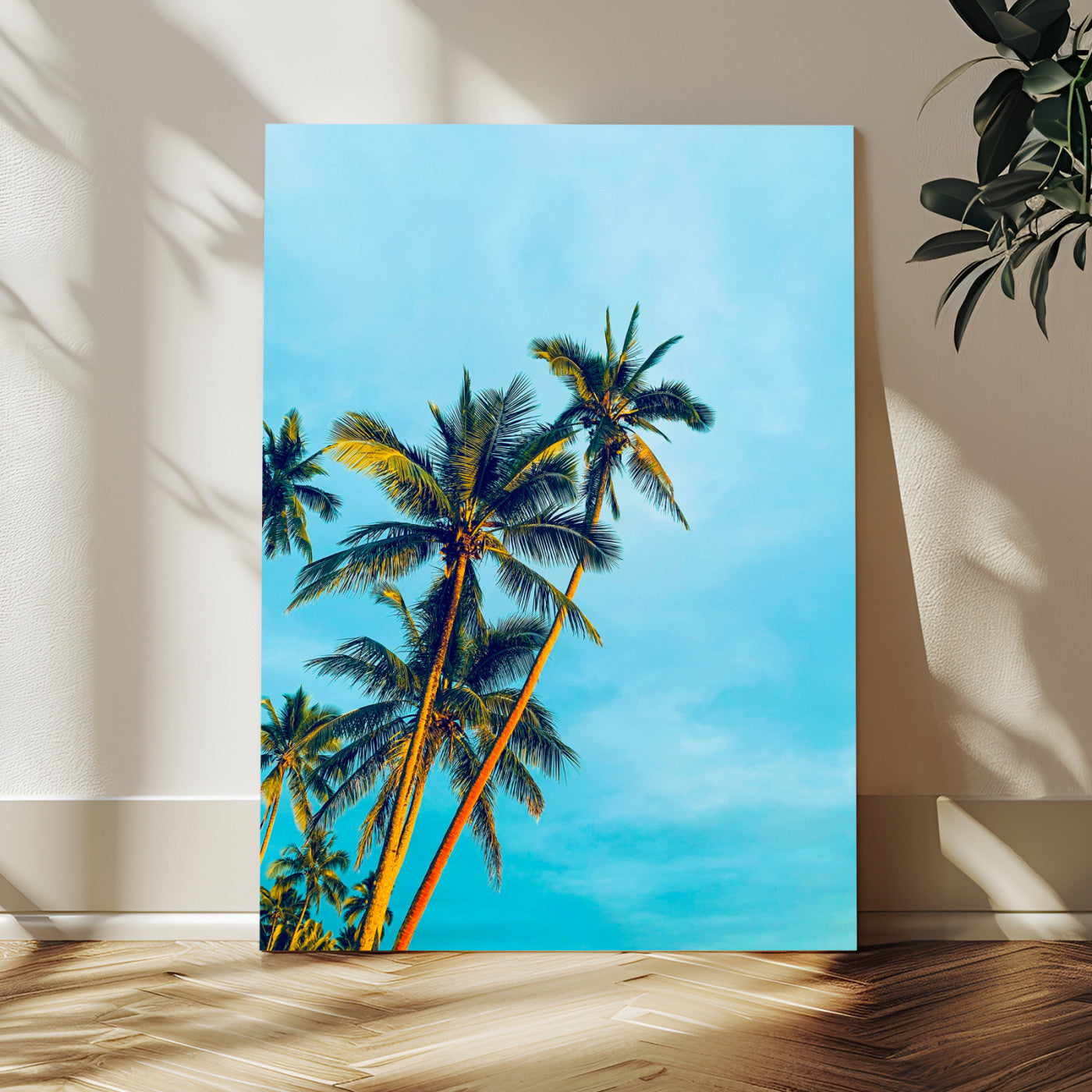 "Tall palm trees with golden sunlight against a vibrant blue sky, creating a tropical, relaxing atmosphere for coastal and beach-themed decor.
