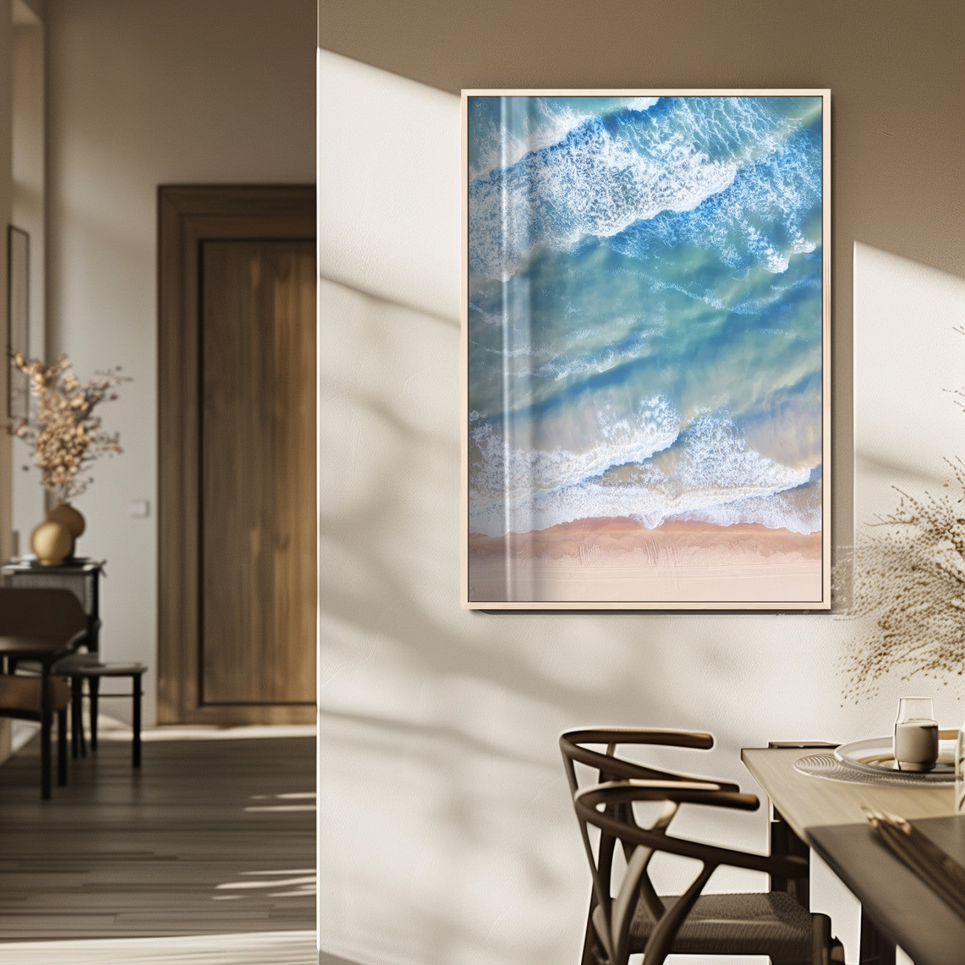 Aerial photo of soft blue waves meeting sandy shore, perfect for modern coastal or beach-themed decor with a light and tranquil aesthetic.