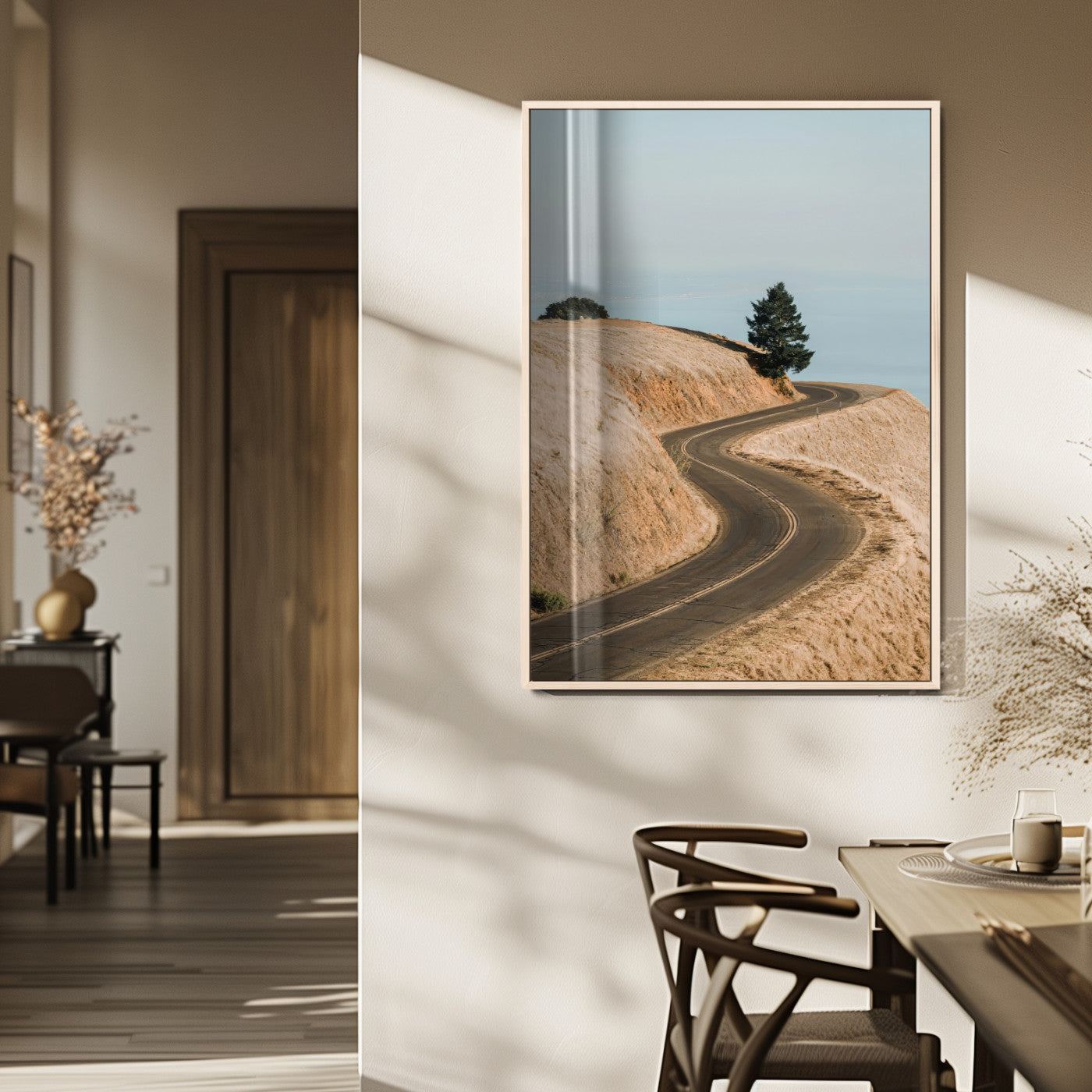 Earth-toned photograph of a winding road through golden hills, ideal for neutral or rustic-themed decor with a calming travel vibe.