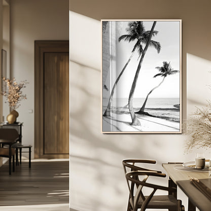 Black and white wall art of palm trees and a hammock on a beach, ideal for coastal minimalist or tropical-themed decor.