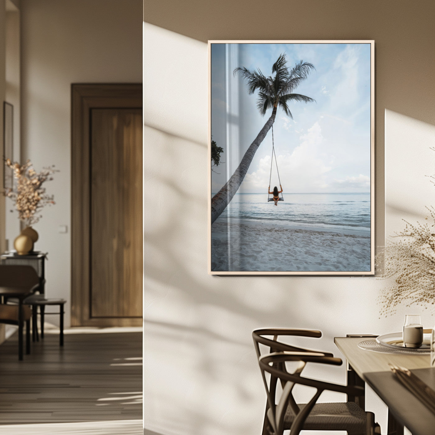 Wall art of a girl on a swing hanging from a palm tree over calm ocean waters, perfect for tropical or minimalist coastal decor.