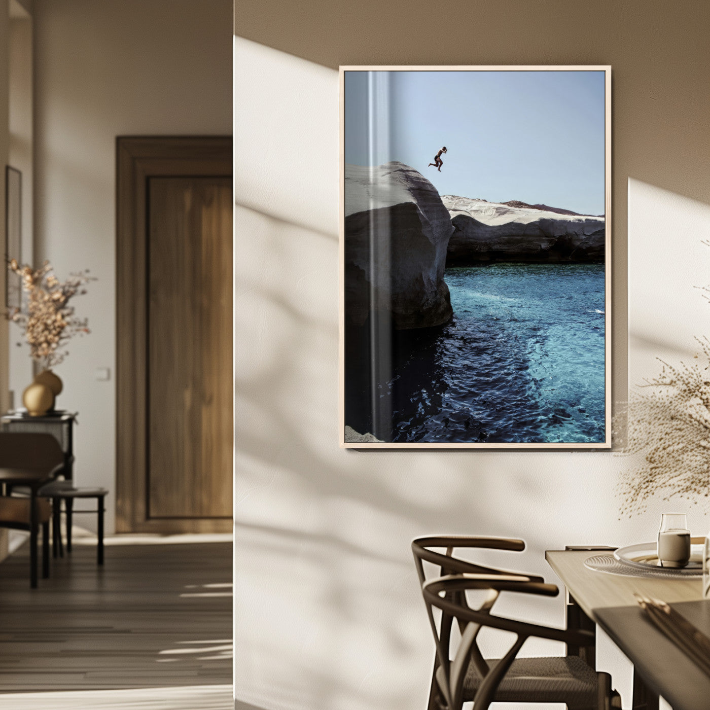 Canvas of a cliff diver above turquoise waters and rocky coastline under clear sky, ideal for adventurous minimalist or coastal home decor.