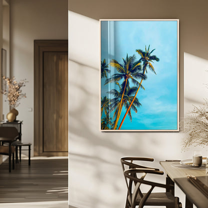 "Tall palm trees with golden sunlight against a vibrant blue sky, creating a tropical, relaxing atmosphere for coastal and beach-themed decor.