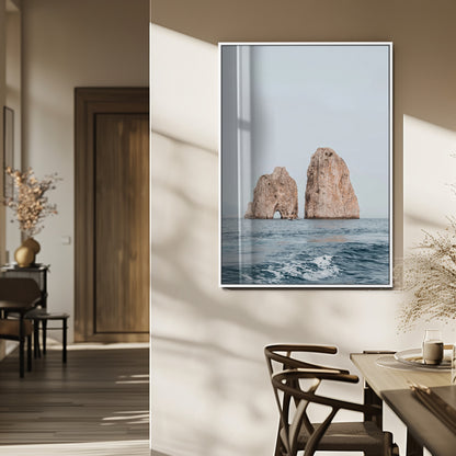 Serene photograph of the Faraglioni rocks in Capri with calm blue waters, perfect for Mediterranean coastal or minimalist travel-themed decor.